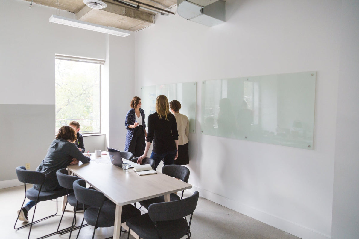 A smart and professional team discussing in an office - an image banner for BrightTailor Services page